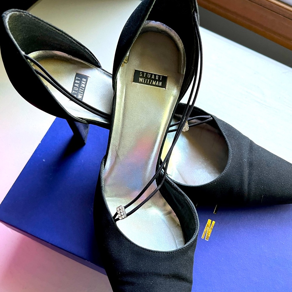 Black crepe Stuart Weitzman heels with rhinestones and leather soles.